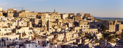 Italy, Basilicata, Matera, Panorama of old town at sunset