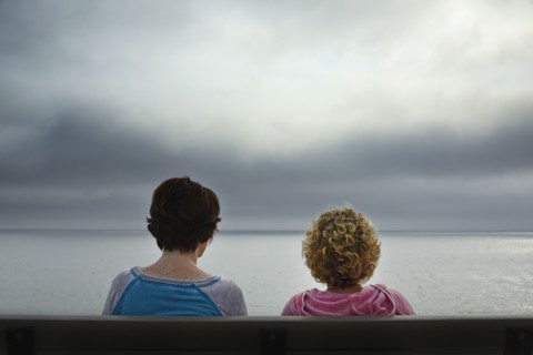 Massachusetts, Cape Cod, Truro, Rear view of two women sitting on bench and looking at sea