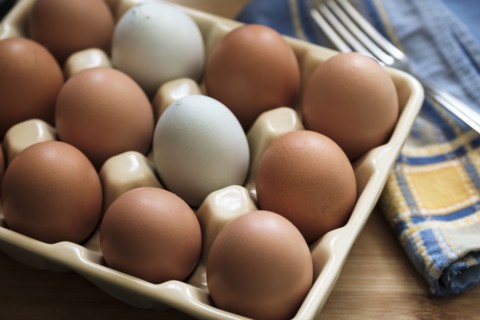 Chicken eggs in carton.