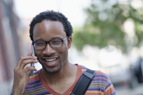 Mid adult man talking on phone.