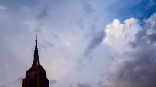 USA, New York, New York City, Empire State Building against clouds.