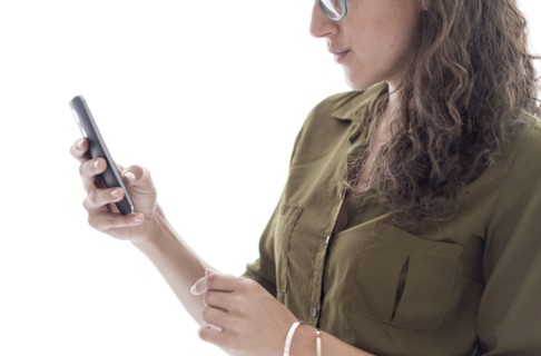 Young woman using smart phone.