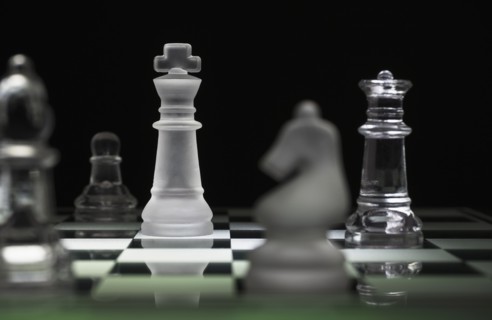 Chess pieces on chess board.