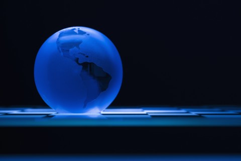 Globe on chess board.