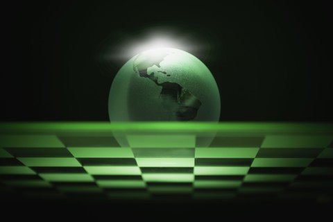 Globe on chess board.