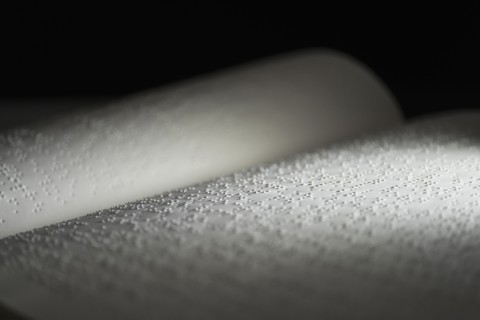 Book with Braille text.