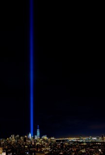 USA, New York State, New York City, Cityscape with light beam over ground zero.