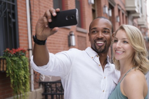 Couple taking selfie.