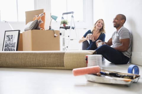 Multi ethnic couple in new apartment.