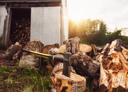 USA, Maine, Knox, Axe beside shed at sunset