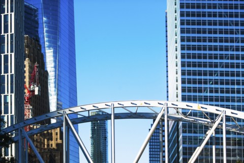 USA, New York State, New York City, Manhattan, Office buildings with bridge in foreground