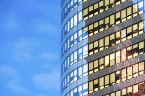 New York, New York City, Curved office building with blue sky in background
