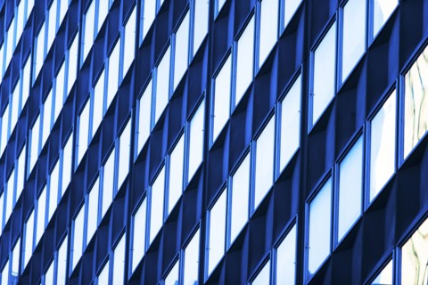 USA, New York, New York City, Glass facade of office building