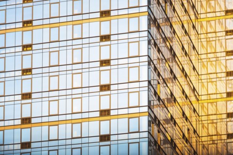 USA, New York, New York City, Glass facade of office building