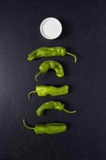 Green Shishito Peppers and salt in ramekin