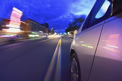 USA, Colorado, Denver, Car on city street at dusk