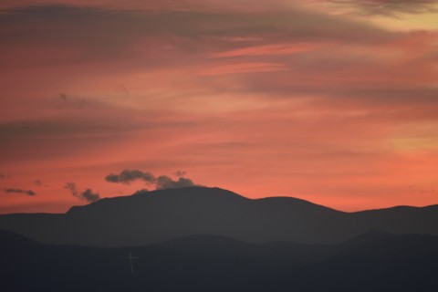 USA, Colorado, Denver, Colorful sky over mountain range
