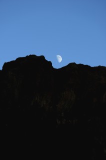 USA, Colorado, Moon over silhouette of rocks in Roxborough State Park