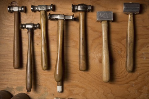 Collection of hammers lying on wood