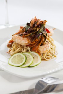 Shrimp and pasta on white plate