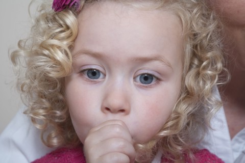 Portrait of girl (4-5) sucking thumb
