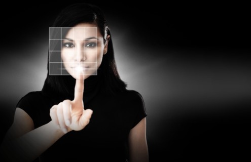 Woman touching virtual screen.