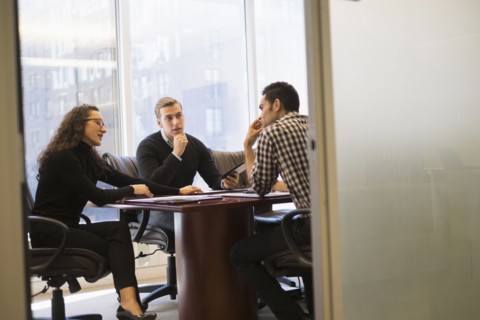 Young business people having meeting in conference room.