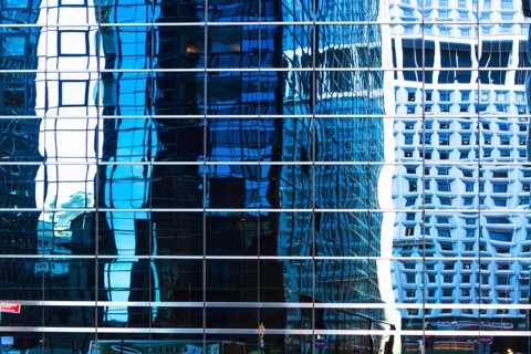 USA, New York, Distorted reflections in office building