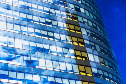 USA, New York, Clouds reflecting in glassy office building