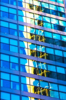 USA, New York, Distorted and blurred reflections in office building