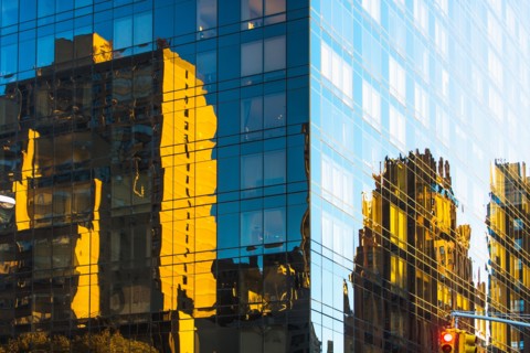 USA, New York, Glassy modern building in big city