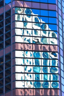 USA, New York, Distorted reflections in Glass building