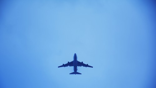 Airplane flying against clear sky