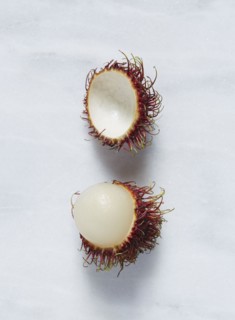 Rambutan (Nephelium lappaceum) fruit against white background