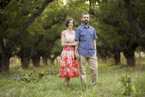 Couple walking in cherry orchard