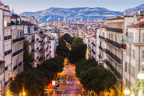 France, Provence-Alpes-Cote d'Azur, Marseille, Street in city, mountain in background