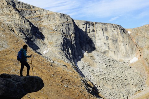 USA, Colorado, Silhouette of hiker on rock ledge along Chicago Lakes Trail in Mount Evans Wilderness Area
