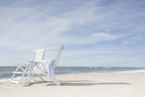 Chairs on beach after sunrise