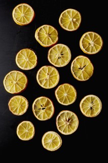 Dried lemon slices on black background