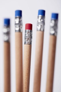 Wooden pencils, one with red eraser