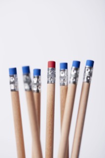 Wooden pencils, one with red eraser