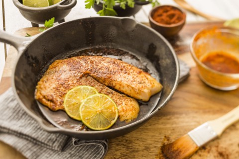 Tilapia on frying pan