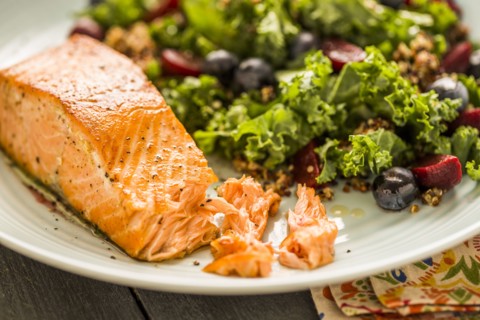 Salmon with salad on plate
