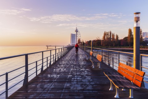 Bridge in city at dawn