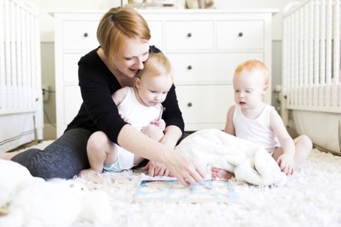 Mother playing with sons (12-17 months) in nursery