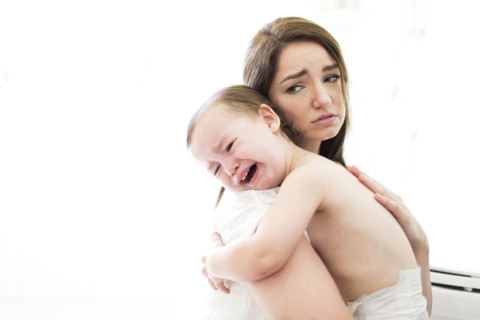 Mother embracing and consoling son (4-5)