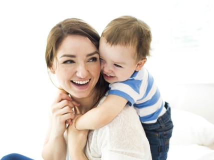 Son (4-5) embracing mother