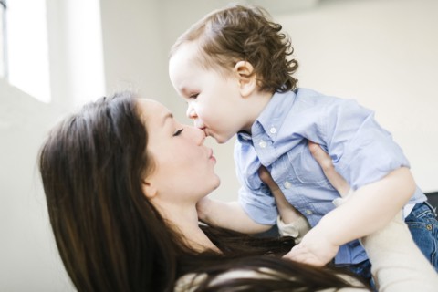 Son (4-5) kissing mother's nose