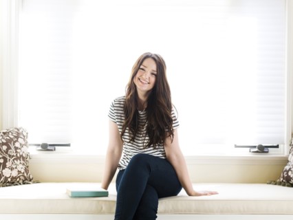 Woman sitting on couch
