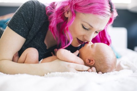 Mother holding newborn son (2-5 months)